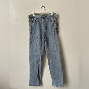 light wash jeans with lace up chains